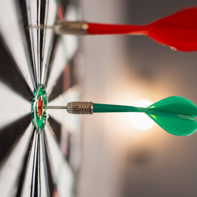 Close up view of dartboard with darts
